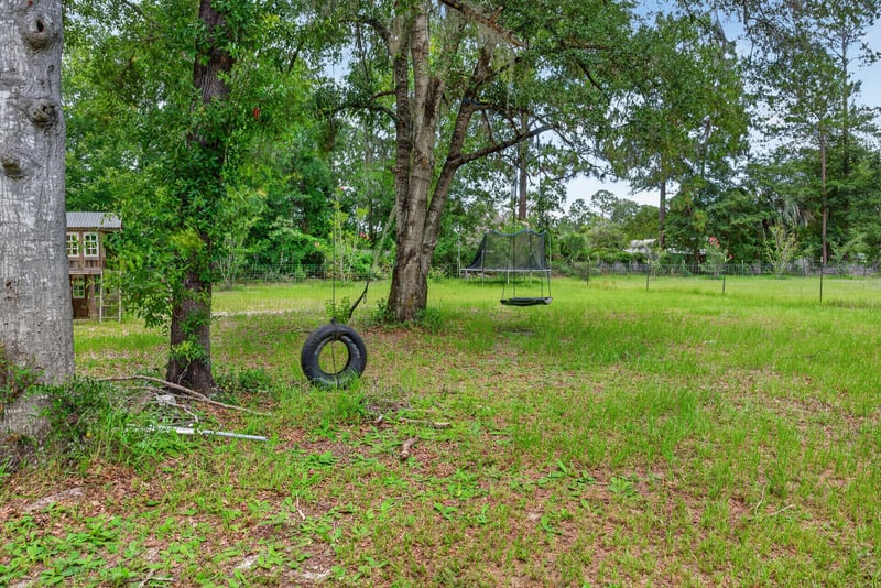 Tire swing hanging from a tree at 4890 McAllister Rd, Middleburg, FL 32068
