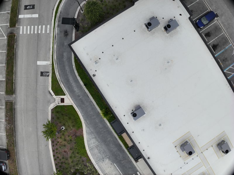 Aerial view of flat rooftop above drive at 9406 Atlantic Blvd, Jacksonville, FL 32225