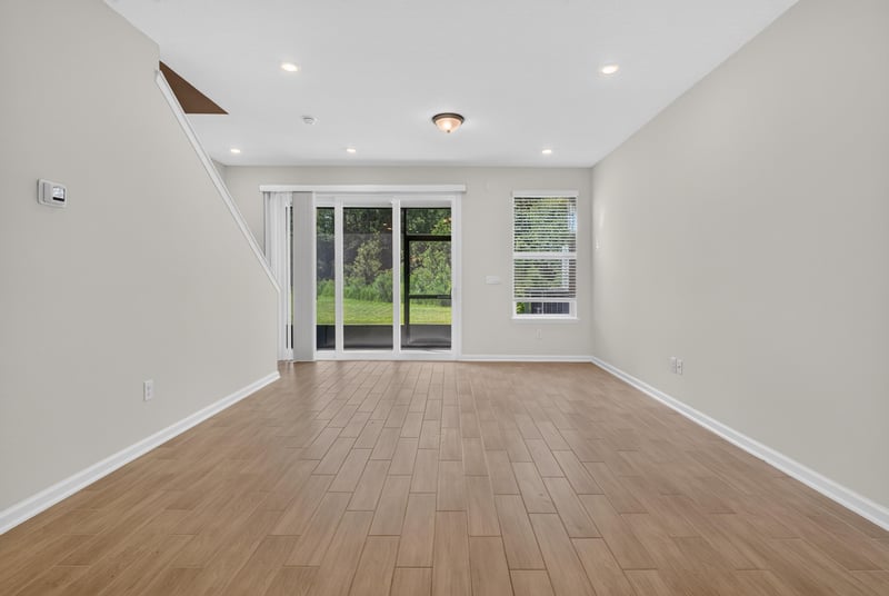 Living room view toward sliding glass door at 39 Mellowood Ln, St. Augustine, FL 32092