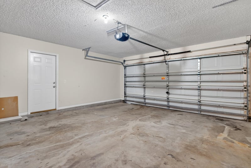 Garage interior with door to house at 1648 Glen Laurel Dr, Middleburg, FL 32068