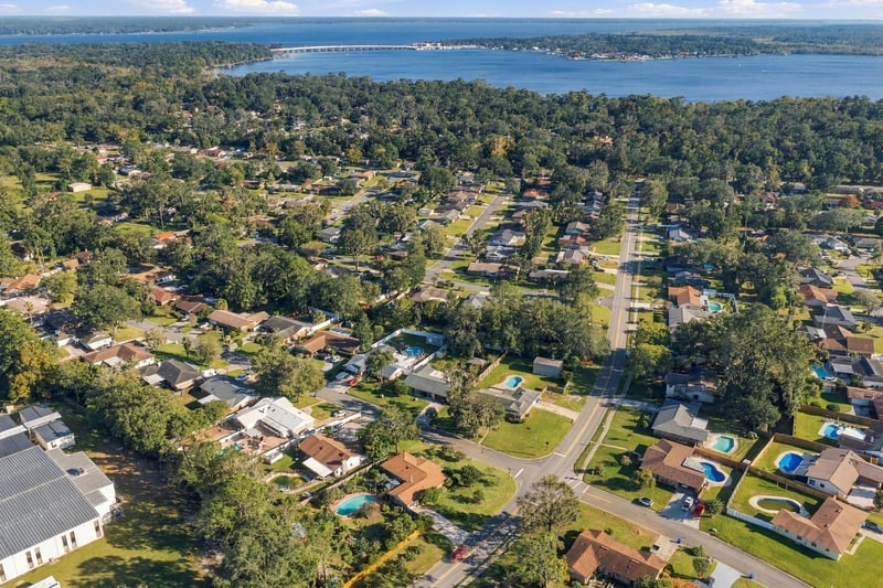 Drone aerial view of the neighborhood toward the lake, photographed by Megapixeler on Crosby Ln, Orange Park