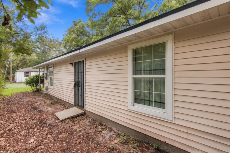Side exterior showing door and windows at 219 Shortreed St, Jacksonville, FL 32254