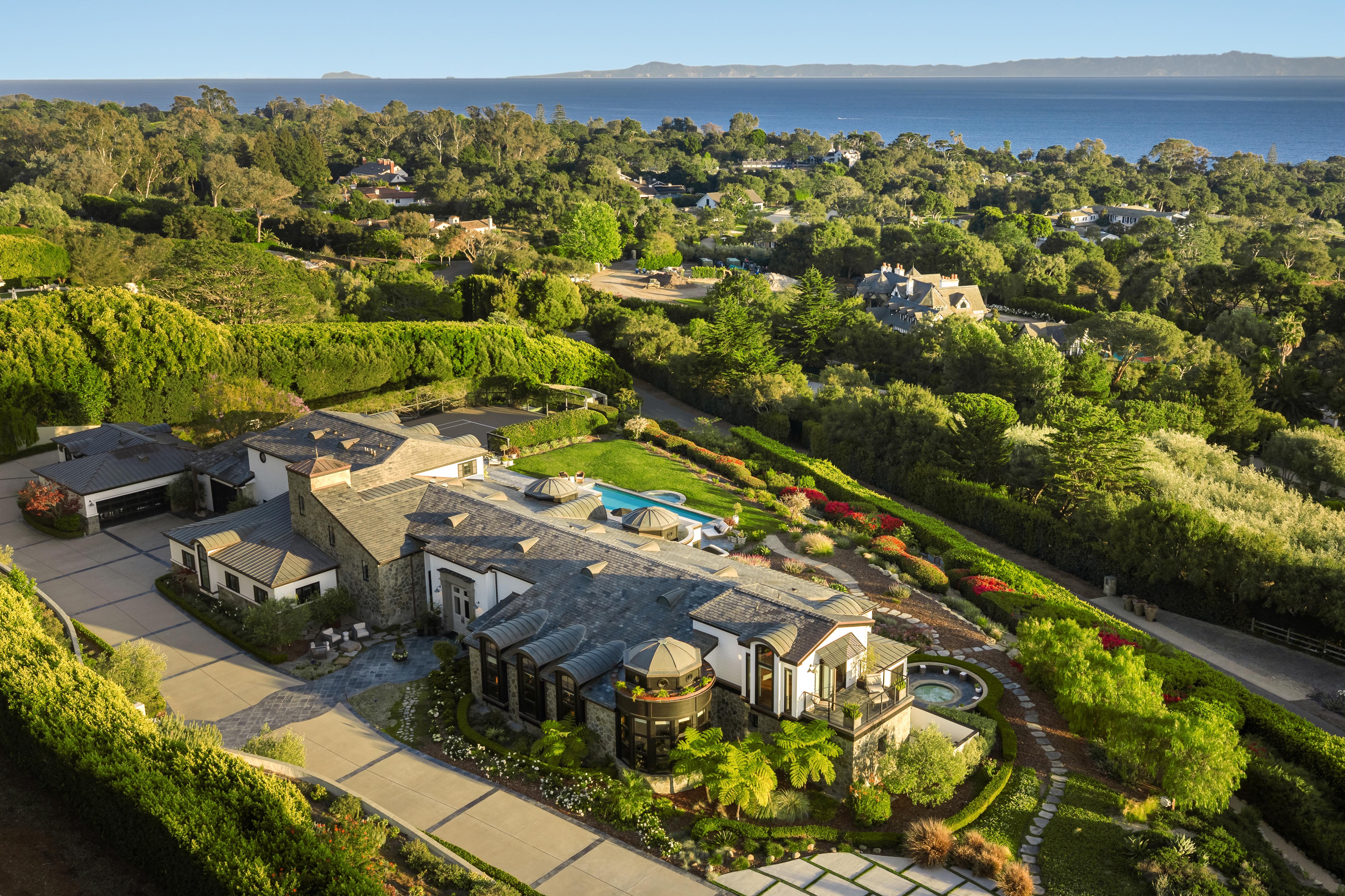 Real estate drone photography of the Cresta Avenue corridor in Santa Barbara at dusk, with Channel Islands visible on the horizon — aerial drone photography by VirTour Media. Our team captured twilight video and daytime and twilight reels from evening through twilight.