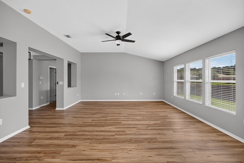 Empty room with wood flooring and windows at 7545 Lirope St, Jacksonville, FL 32244