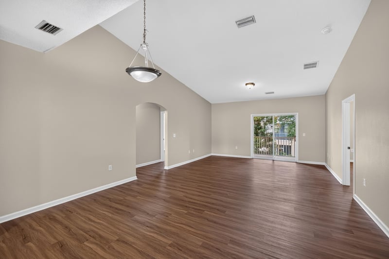 Entry foyer with vaulted ceiling and wood-look flooring at 3750 Silver Bluff Blvd, Orange Park, FL