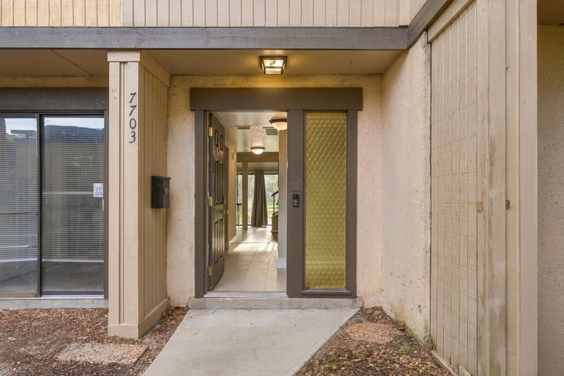 Front door close up with unit number 7703 at 7703 Las Palmas Way