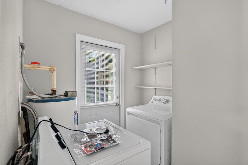 Bedroom with closet doors and wood-look flooring at 255 Woodside Dr, Orange Park, FL 32073