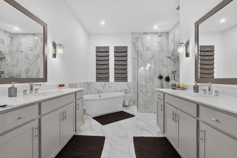 Primary bathroom with dual vanities and soaking tub at 785 Back Creek Dr, St. Augustine, FL 32092