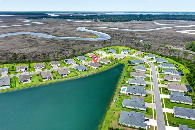 Drone view of the home's location by the pond in Fernandina Beach, FL