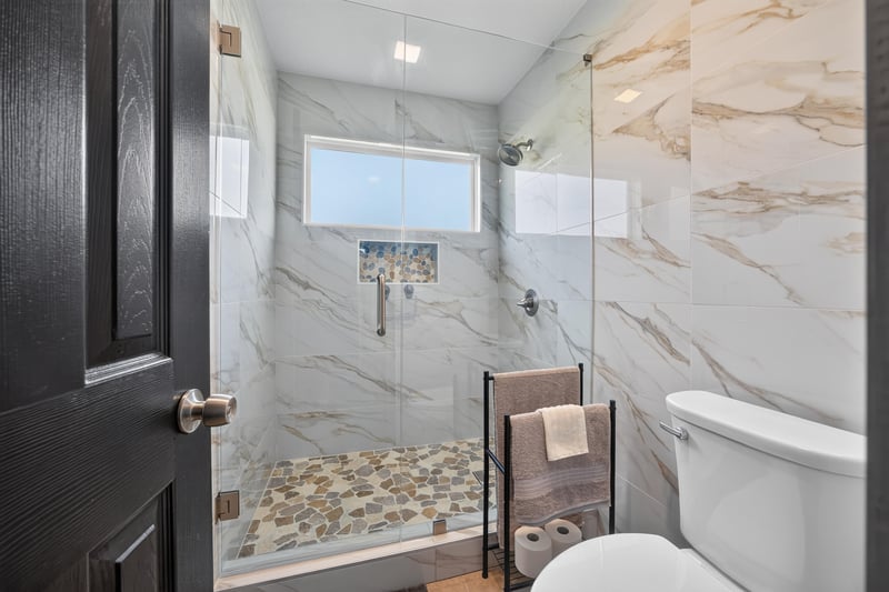 Bathroom with glass shower and soaking tub at 6931 Cane Grass Ln E, Jacksonville, FL 32244