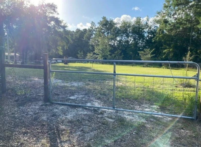 Metal gate at the edge of the property at 4890 McAllister Rd, Middleburg, FL 32068