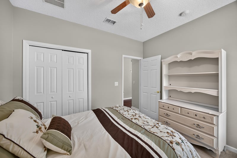 Bedroom with white furniture and natural light at 3660 Middlebrook Dr, Orange Park, FL 32065