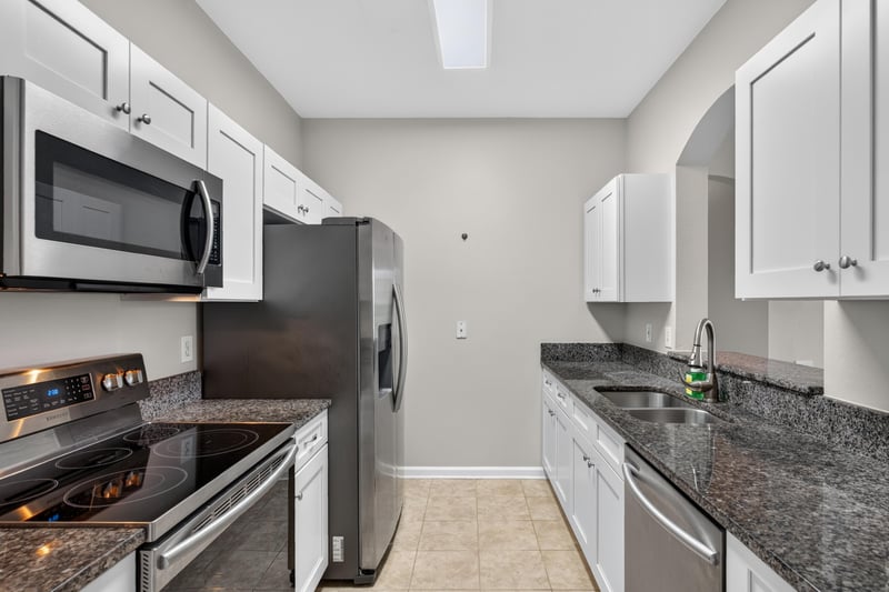 Kitchen with granite counters and stainless range at 7990 Baymeadows Rd E #404, Jacksonville, FL 32256