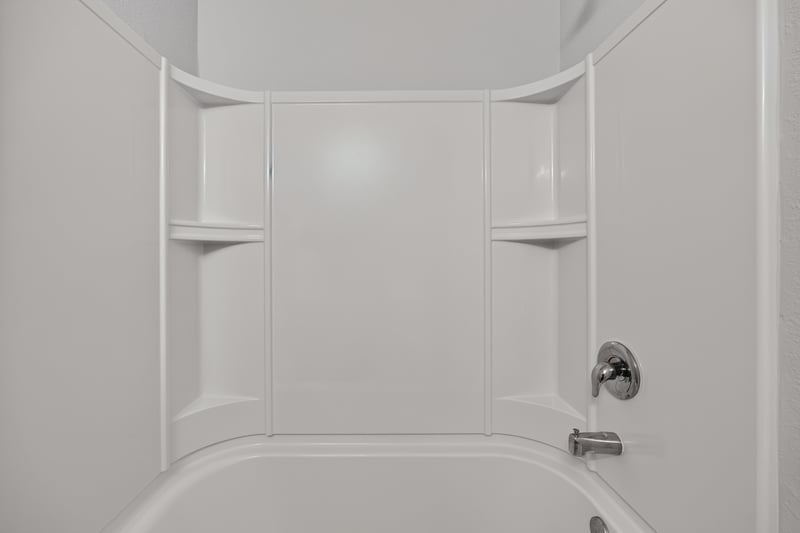 Bathroom tub-shower with corner shelving at 2837 Black Buck Cir, Jacksonville, FL 32225