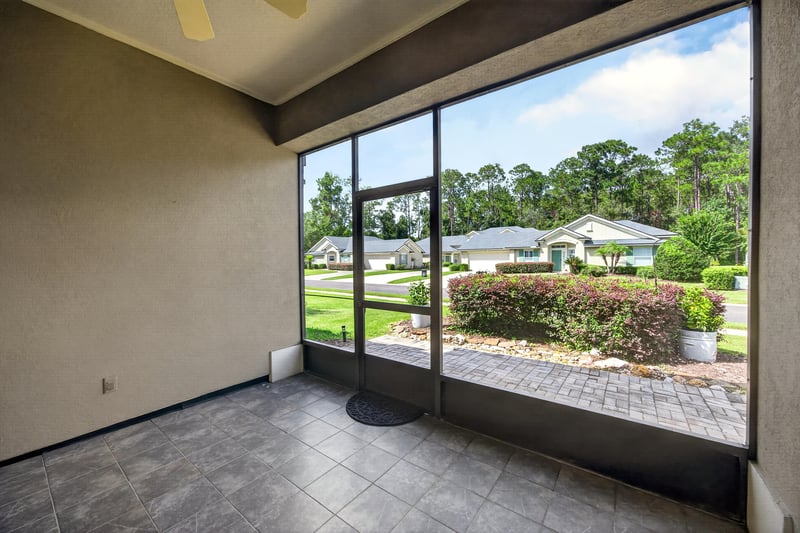Sunroom with tile floor and glass walls at 2131 E Stone Creek Dr, Fleming Island, FL
