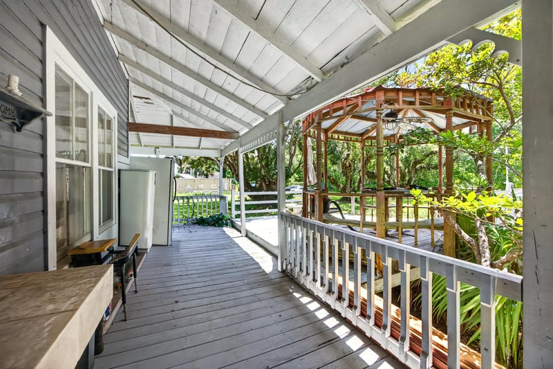 Covered porch view toward gazebo and yard at 1173 US-17, Satsuma, FL 32189