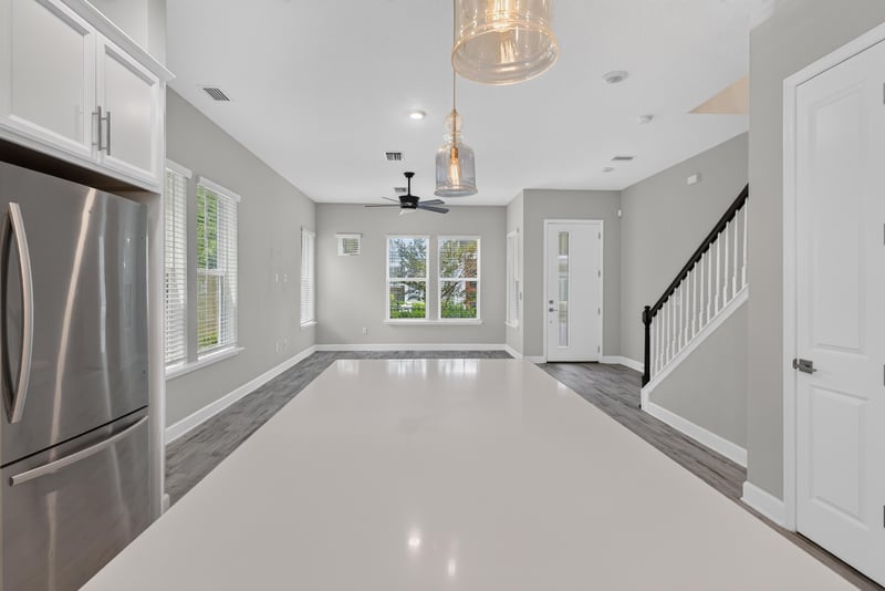 Great room view from kitchen to entry at 7446 Loggerhead Ct, Jacksonville, FL 32256