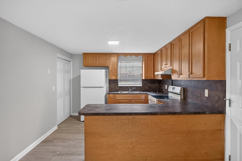 Kitchen with refrigerator and cabinet pass-through at 1435 Undine Ave, Jacksonville, FL
