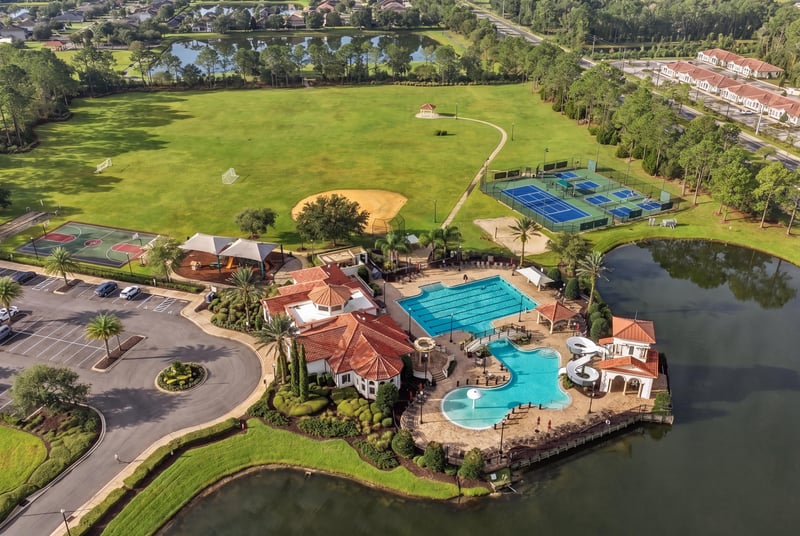 Aerial view of tennis courts and community pool in Murabella
