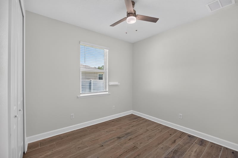 Bedroom with ceiling fan and window at 855 Flach Dr, St. Johns, FL