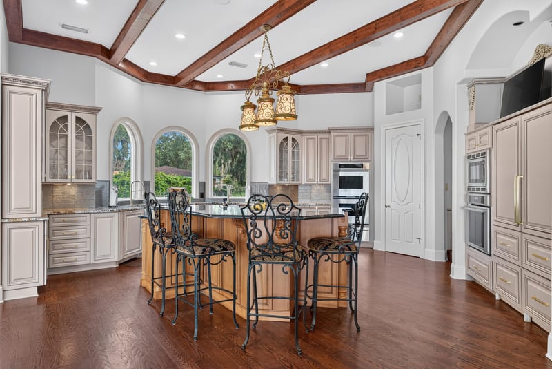 Kitchen with wood beam ceiling and island seating at 344 Broward Rd, Jacksonville, FL
