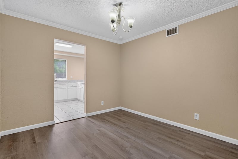 Empty room with doorway to kitchen at 5811 Atlantic Blvd unit 47, Jacksonville, FL 32207
