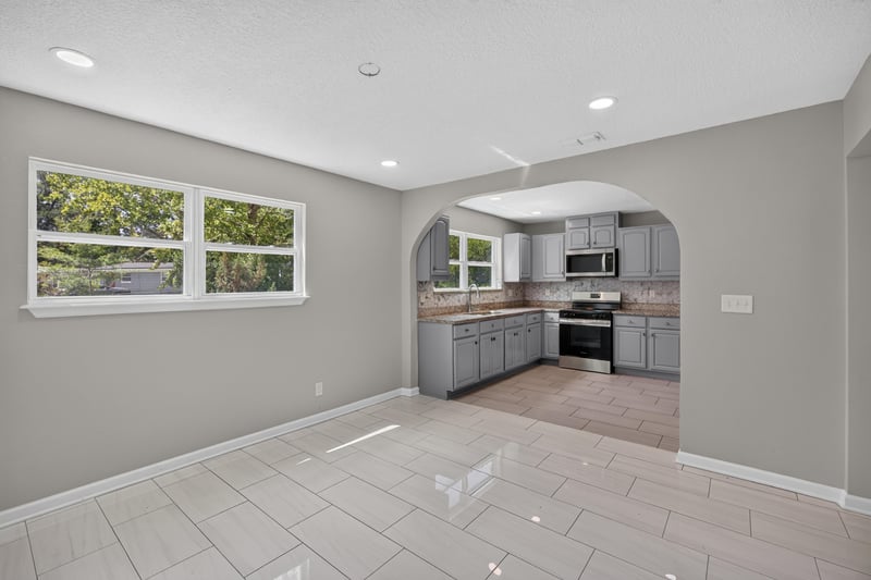 Empty dining area with window and tile floor at 7015 Miss Muffet Ln N, Jacksonville, FL 32210