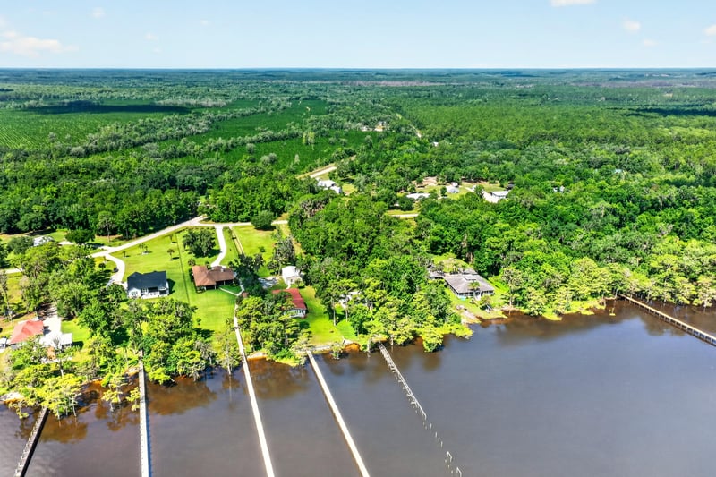 Aerial view of the river shoreline and docks at 110 River Shores Rd, Palatka, FL 32043