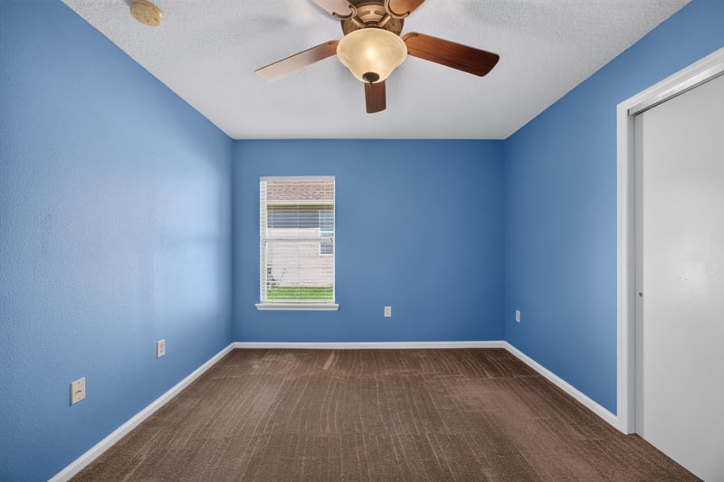 Empty bedroom with closet and window at 2282 Justin Lake Dr, Jacksonville, FL