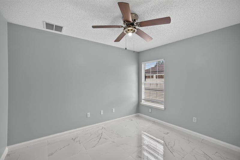Bedroom with window and tile flooring at 490 Hillside Dr, Orange Park, FL 32073