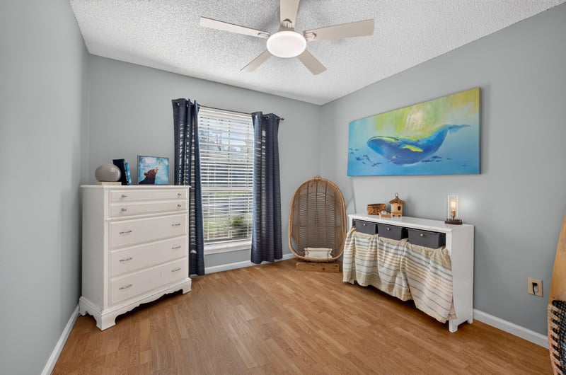 Bedroom with dresser and window at 4556 Shaky Leaf Ln N, Jacksonville, FL 32224