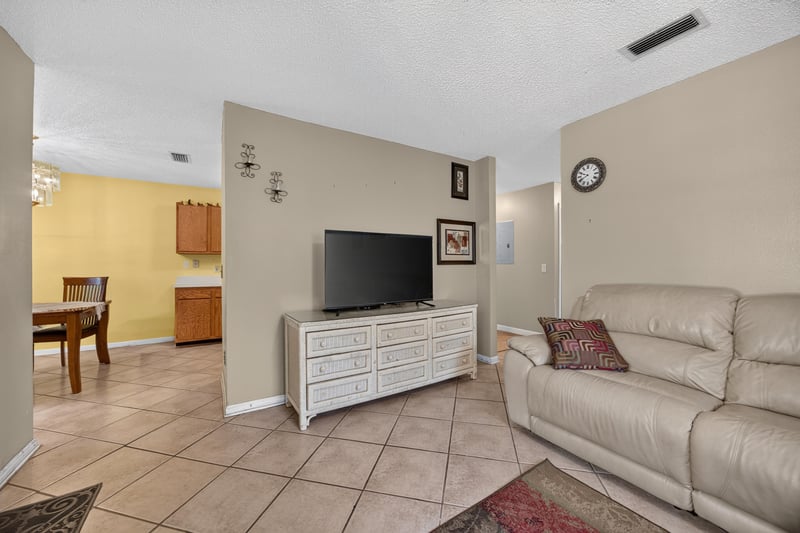 Living room with TV stand and tile flooring at 5375 Dodge Rd, Jacksonville, FL 32209