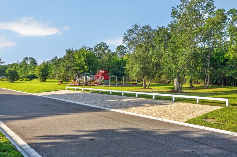 Community street with playground in the distance in Green Cove Springs, FL