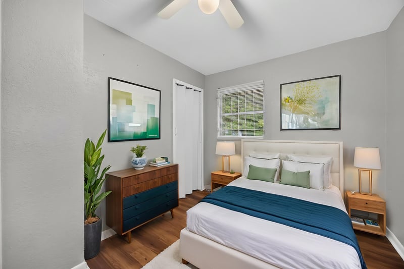 Virtually staged bedroom with bed, dresser and artwork at 4030 Leonard Cir W, Jacksonville, FL 32209