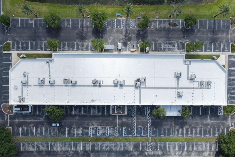 Aerial view of a building roof with HVAC units in rows at 10550 Deerwood Park Blvd, Jacksonville, FL 32256