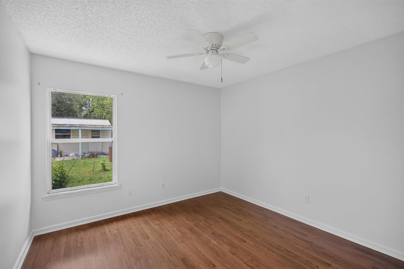 Bedroom with ceiling fan and window at 9691 Nelson Forks Dr, Jacksonville, FL 32222