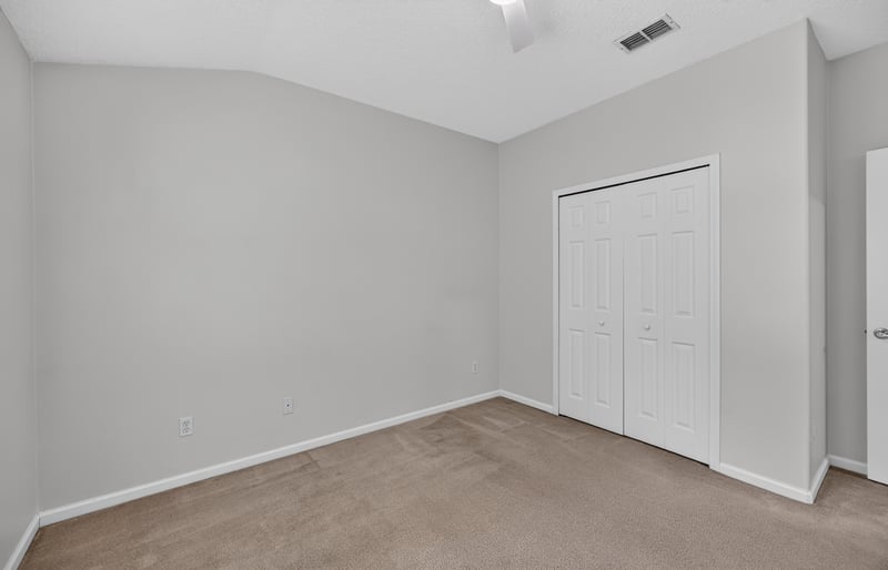Bedroom with closet and carpet flooring at 2480 Ridge Will Dr, Jacksonville, FL 32246