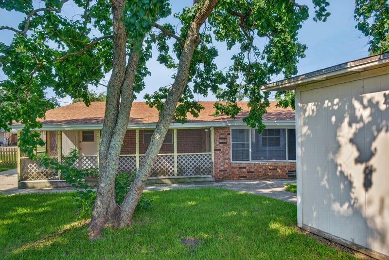 Backyard with storage shed and shade trees at 5503 Boeing Dr, Jacksonville, FL 32207