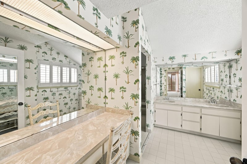 Bathroom vanity with palm leaf wallpaper at 752 Spinnakers Reach Dr, Ponte Vedra Beach, FL 32082