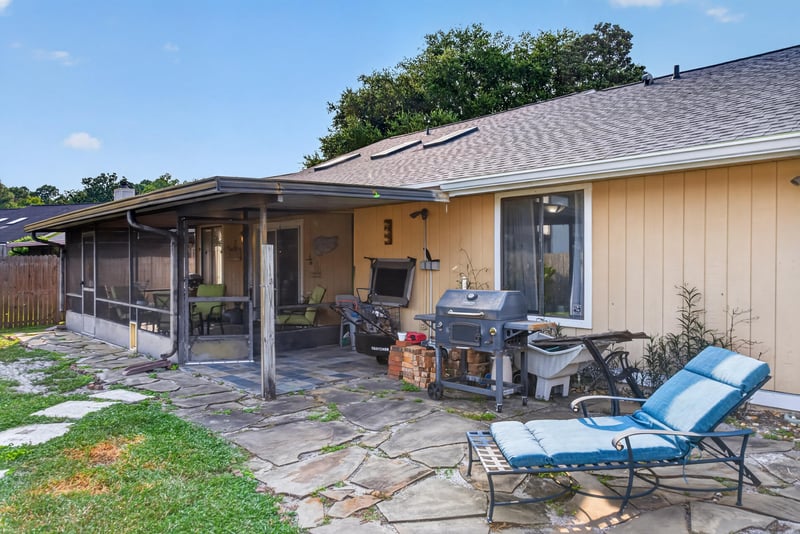 Screened porch with grill and patio furniture at 13020 Medford Ln, Jacksonville, FL 32225