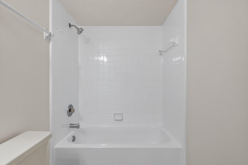 Bathroom tub and tile shower surround at 1445 Classic Oak Rd W, Jacksonville, FL
