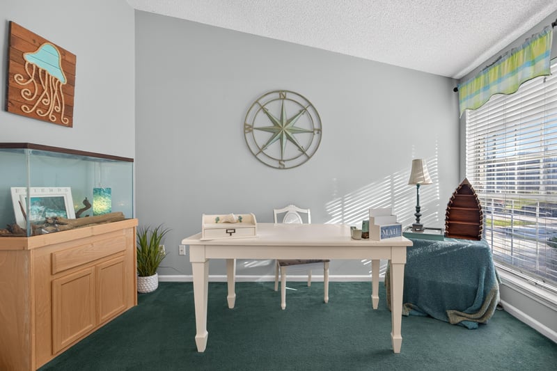 Den with desk and built-in bookshelf at 4556 Shaky Leaf Ln N, Jacksonville, FL 32224