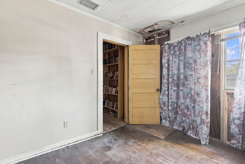 Room with built-in shelving and curtained doorway at 1807 Idlewild Ave, Green Cove Springs, FL