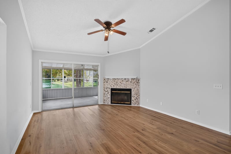 Living room view toward fireplace and front door at 8047 Mactavish Way E, Jacksonville, FL 32244