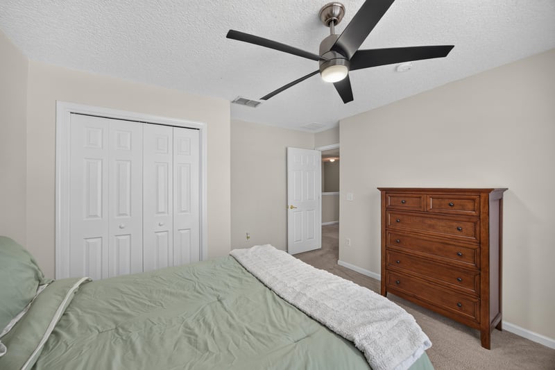 Bedroom with wood dresser and ceiling fan at 3660 Middlebrook Dr, Orange Park, FL 32065