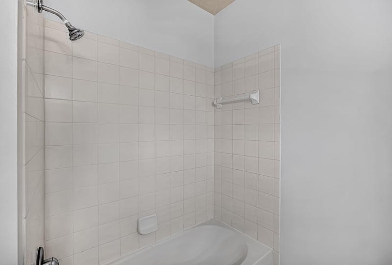 Bathroom shower with tile surround at 3750 Silver Bluff Blvd, Orange Park, FL