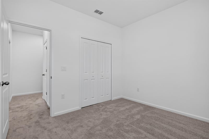 Empty bedroom with closet doors at 269 Bluegrass Wy, St. Augustine, FL 32092