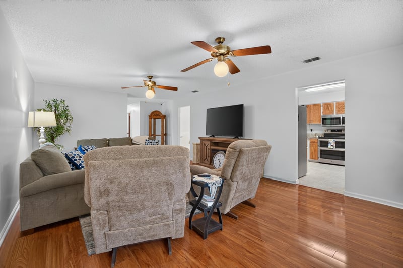 Living room with recliner and television at 2435 Range Line Rd, Middleburg, FL