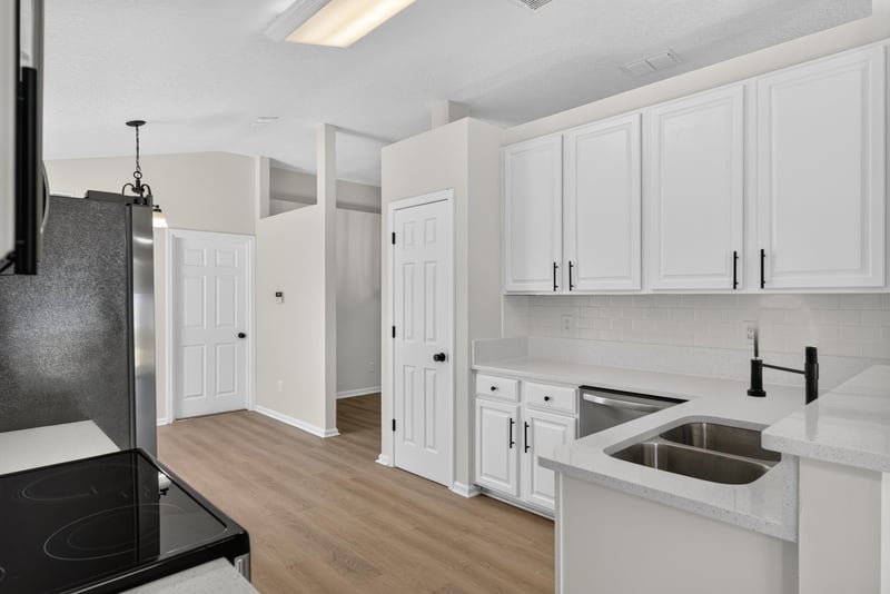 Kitchen with black range and farmhouse sink at 224 Pine Arbor Cir, St. Augustine, FL 32084