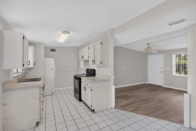 Kitchen opening into living room at 87 Saratoga Cir S, Atlantic Beach, FL